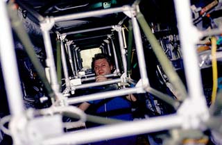 Mir commander Yuri Onufriyenko's head pokes up through truss.